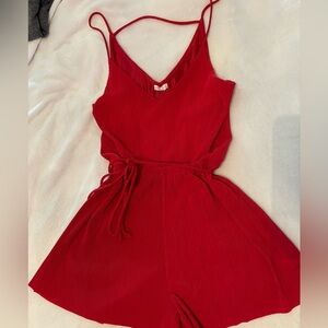 Super cute red ribbed romper with belt still in great condition barely worn.